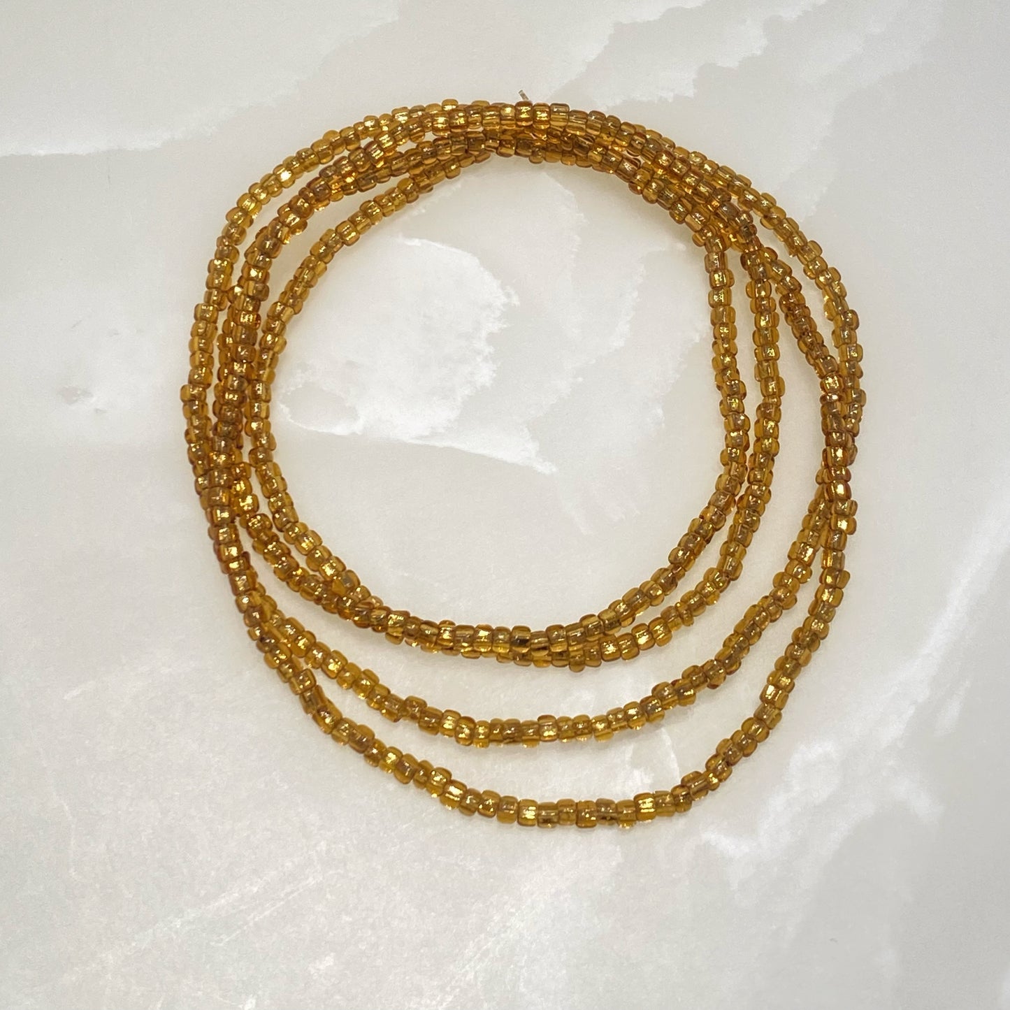 Perles de taille couleur or Nefer