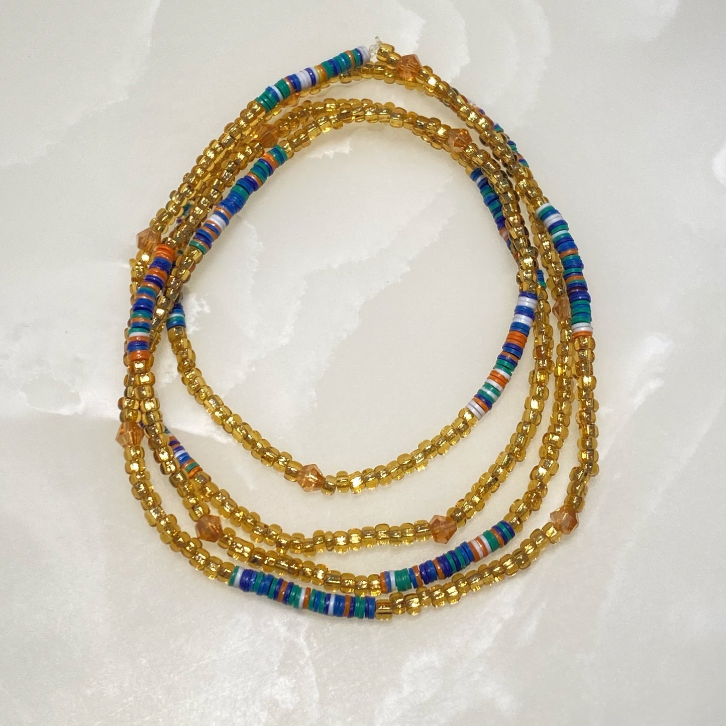 perles de tailles couleur or et bleu Nefer
